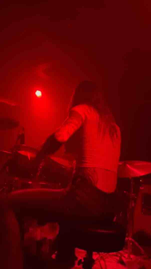 Felicity Feline rocking out with Knucklehead Hollywood, she’s beating the drums like the owe her money.